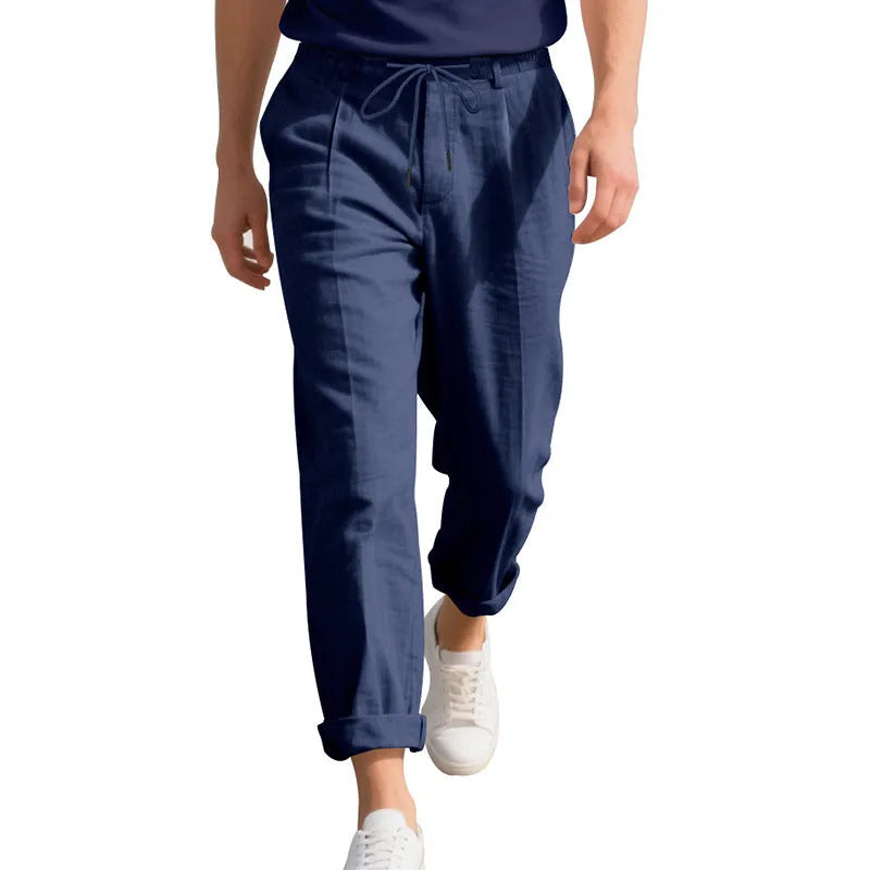Men's casual linen trousers in a straight leg cut with a drawstring waist, shown in a light colour.