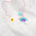 Handmade crocheted wool car pendant with avocado and rainbow design in three colour variations