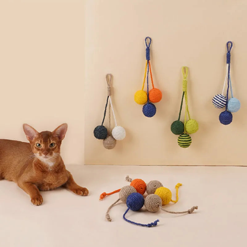 Cat toy set with teaser stick and colourful catnip balls on blue background