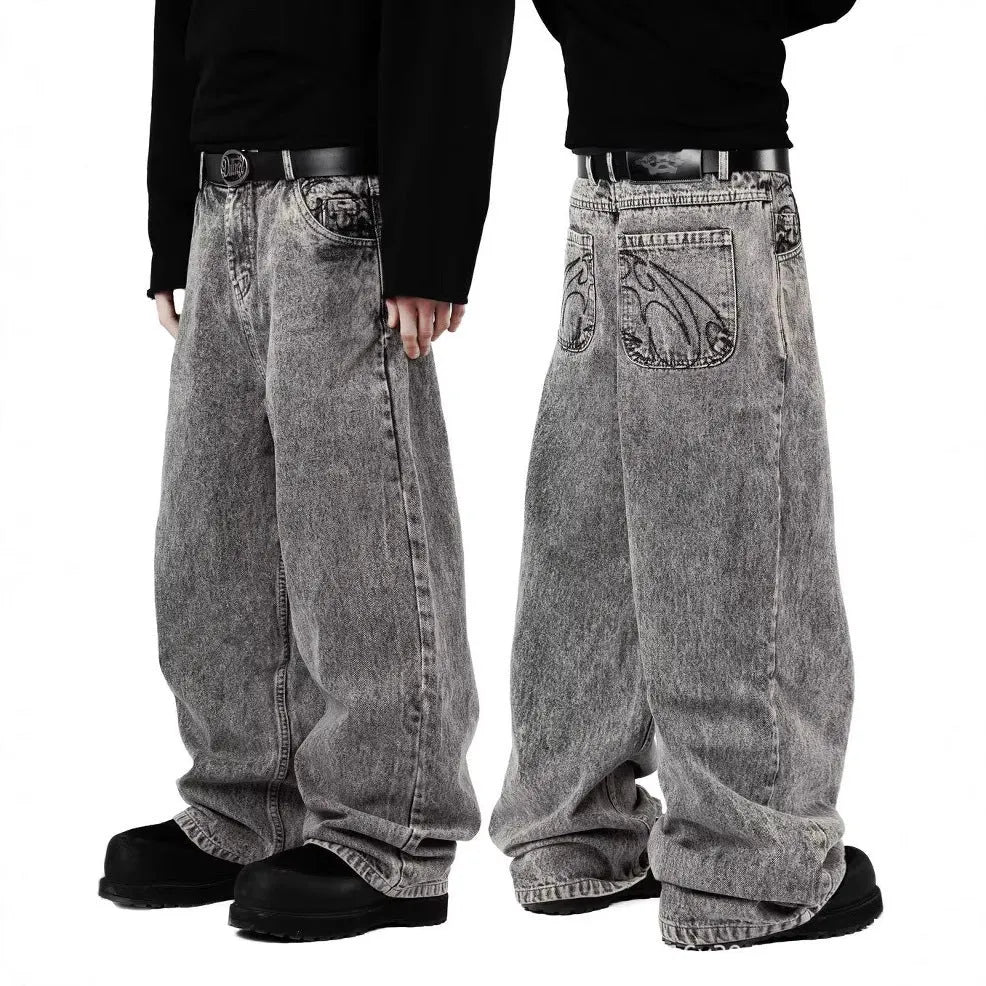 Grey loose straight-leg cotton denim trousers for men and women on a hanger