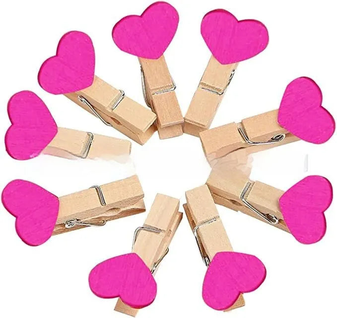 Set of five handmade solid wood heart-shaped clips in various colours