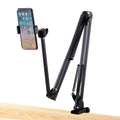 Black foldable metal cantilever bracket holding a tablet on a desktop.
