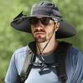 A man wearing a customisable solar-powered fan hat with a cooling fan visible on the brim, shown in a khaki colour.