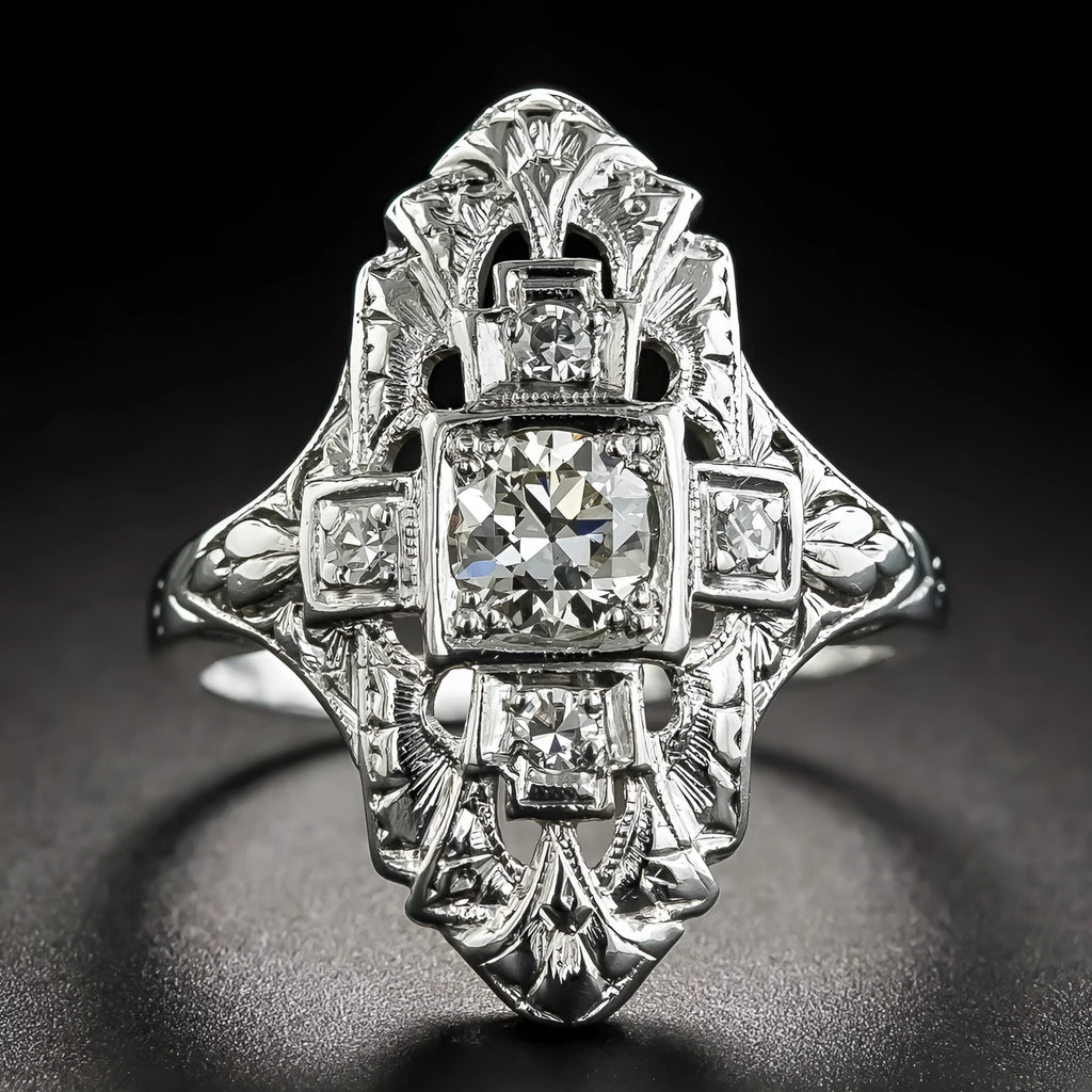 Geometric hollow out silver ring with diamond studs on a copper base.