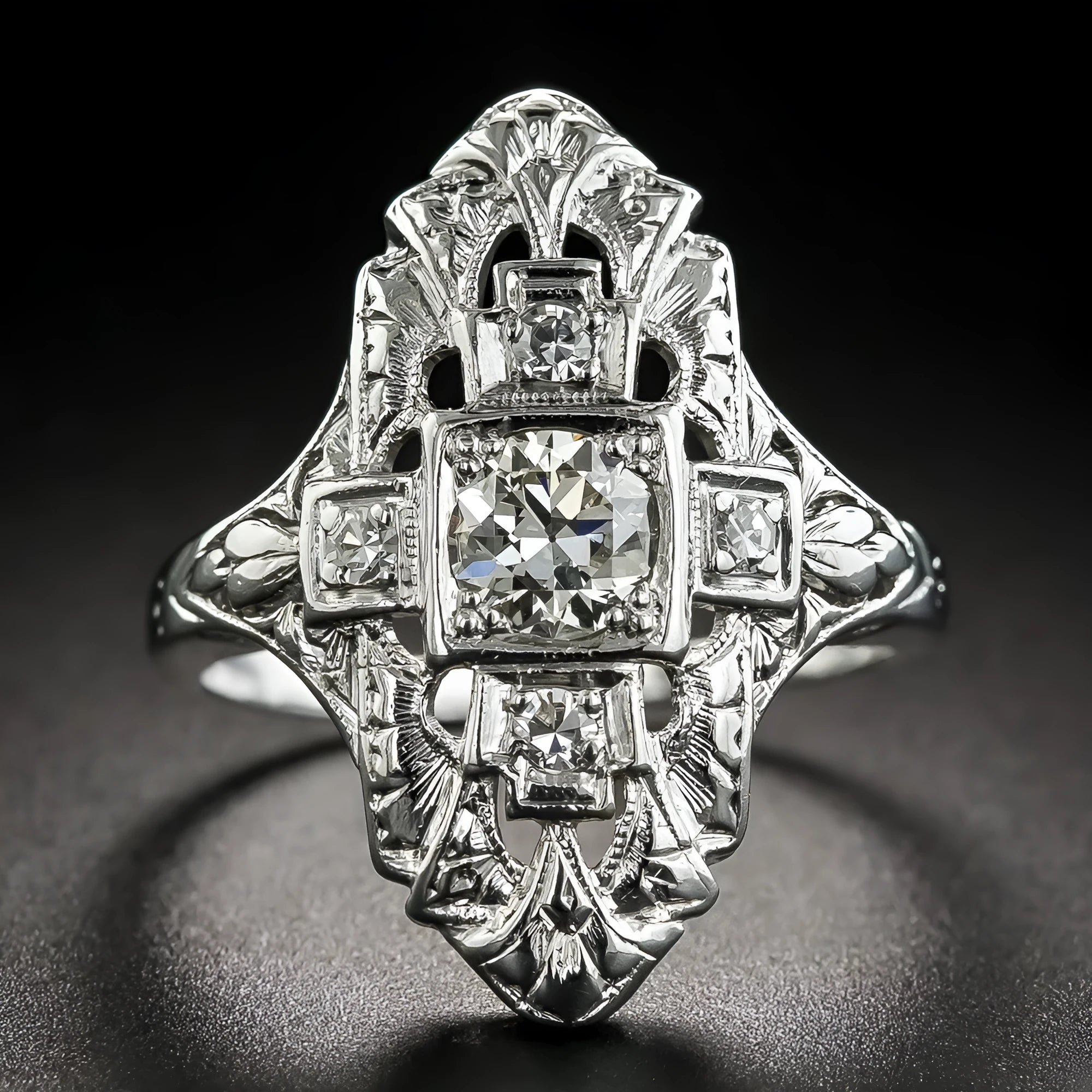 Geometric hollow out silver ring with diamond studs on a copper base.