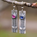 Antique finish geometric earrings with red sapphire ellipse details on electroplated metal