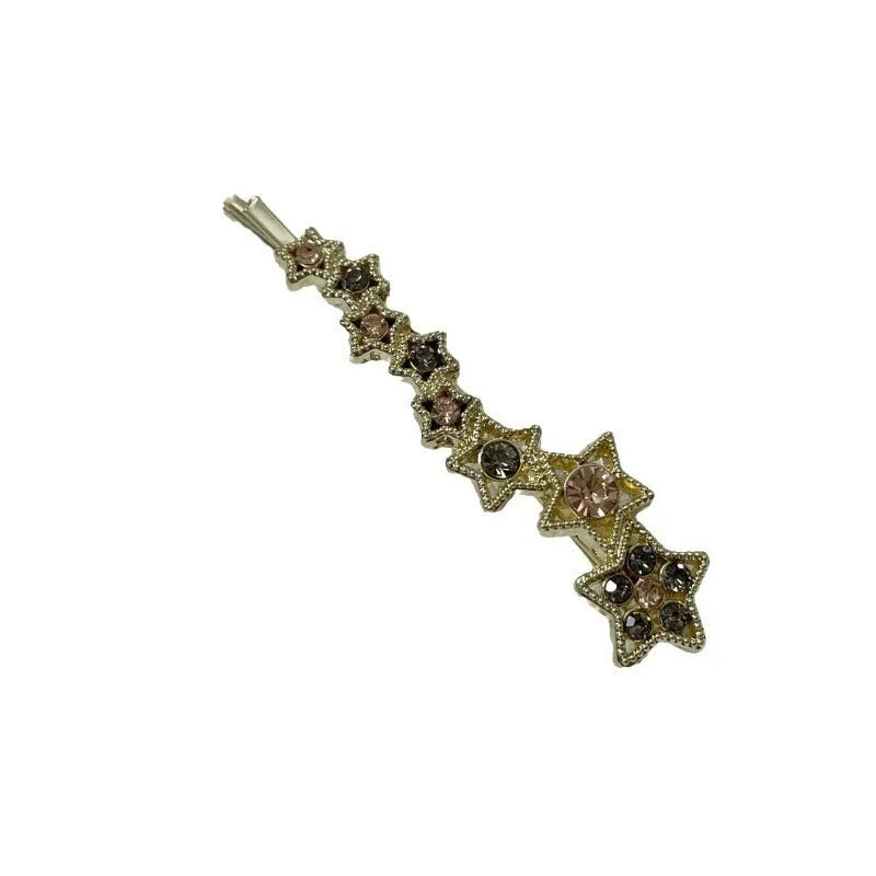Gold electroplated rhinestone barrette with star design and side clip for bangs