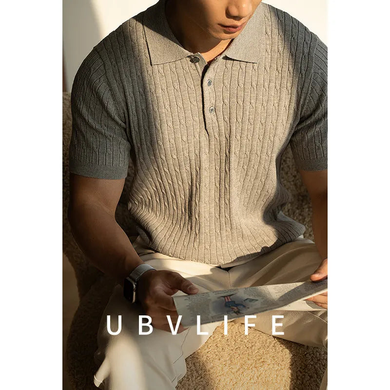 Men's khaki short-sleeve business top on a hanger.