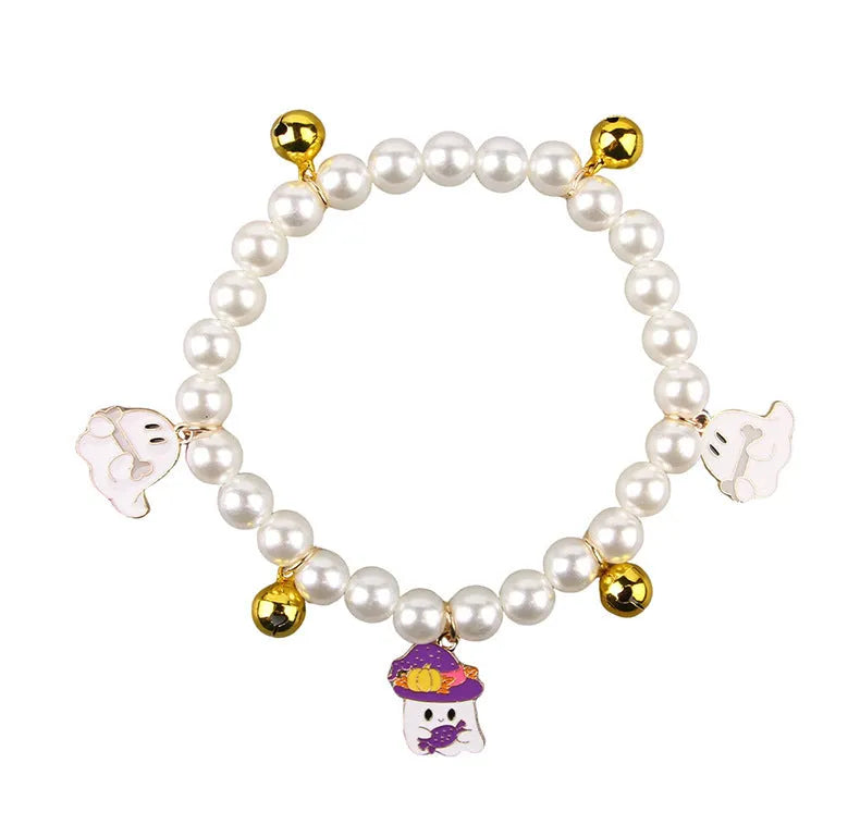 Halloween pet collar charm with simulated pearls and a choice of pumpkin or ghost decoration.