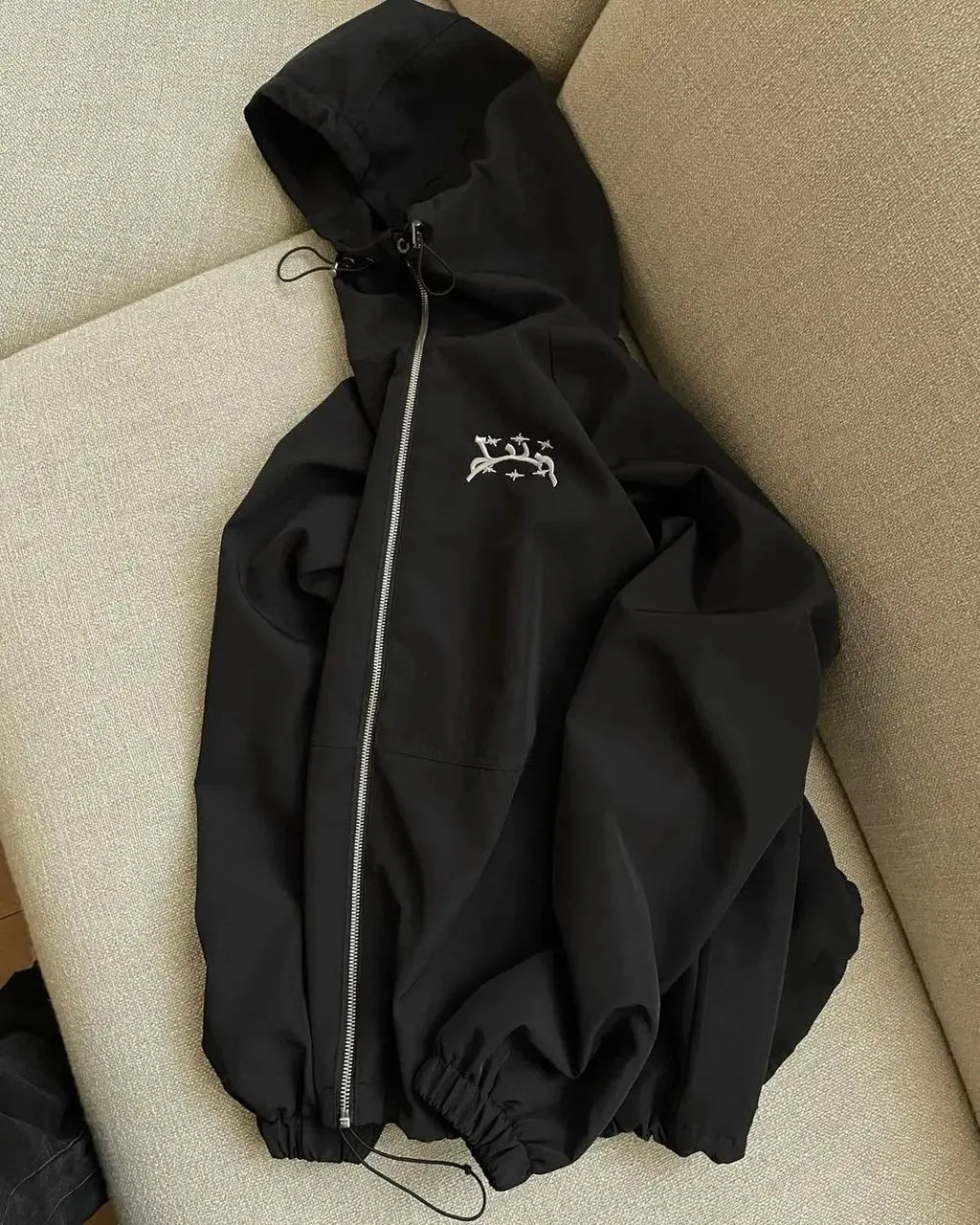 Men's loose fit grey hooded sunscreen jacket showing front view with polyester fabric texture detail