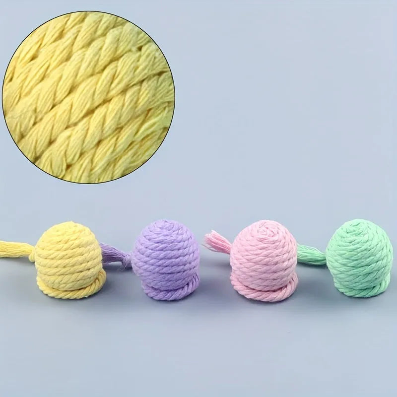 Green cat toy ball with a built-in rope and bell in a 6cm size.