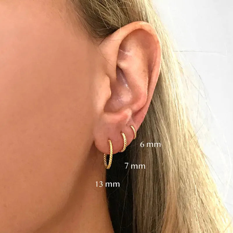 S925 sterling silver twisted string round ring earrings in gold or white gold finish.