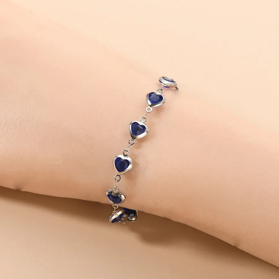 A stainless steel geometric heart bracelet with a Devil's Eye design in one of six electroplated colour options.