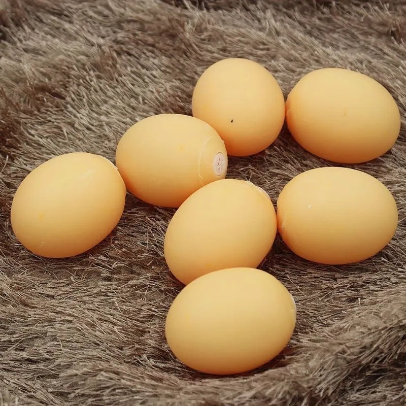White simulation egg shaped dog toy with textured surface for teeth cleaning