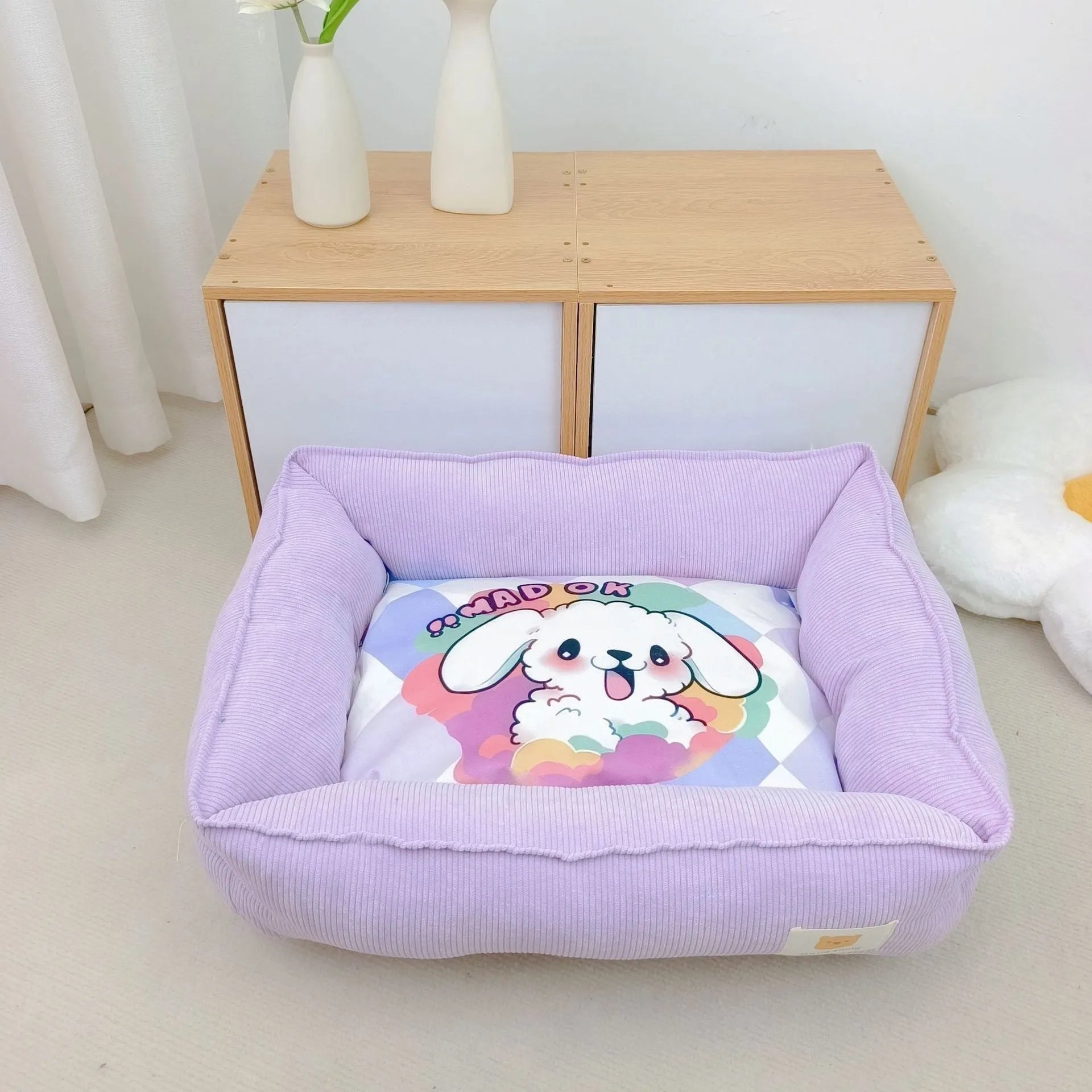 Rectangular cloth pet nest for dogs and cats in a choice of colours, shown in two available sizes.