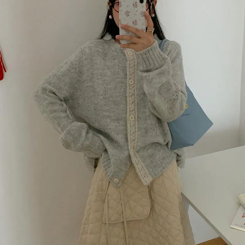 Women's loose artistic retro cardigan sweater coat in light grey viscose fibre, shown open as a layering piece.