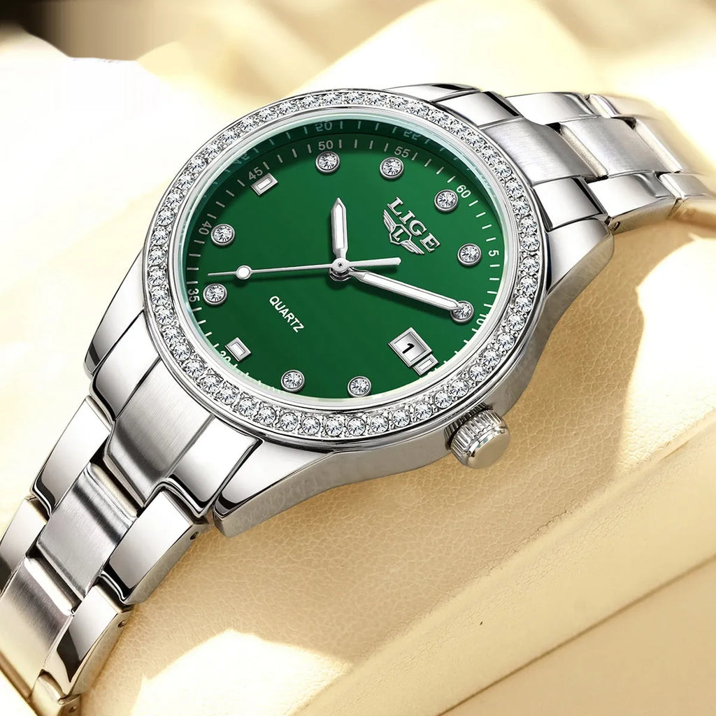 Women's silver quartz watch with diamond-encrusted bezel and luminous dial on stainless steel strap