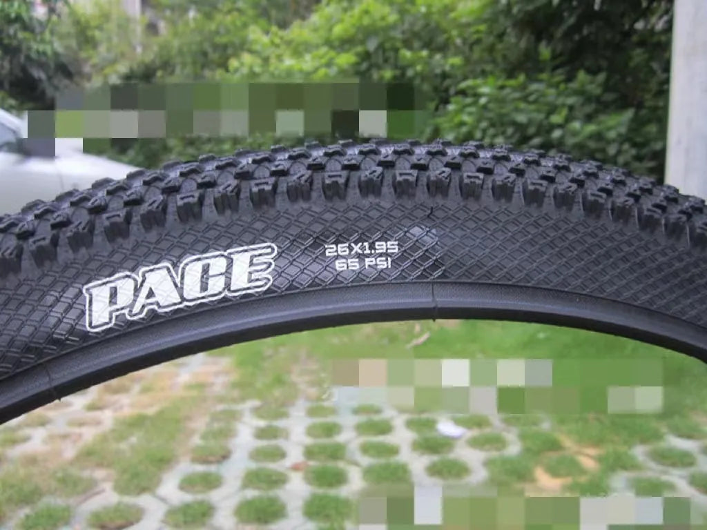 Ultralight mountain bike tyre with reinforced sidewall shown in black, suitable for 26, 27.5 or 29 inch wheels