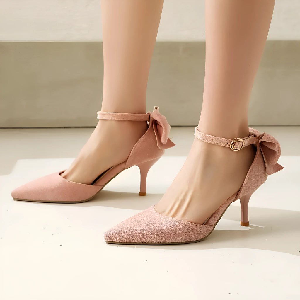 Women's suede stiletto heels with pointed toes and decorative bowknot detail in black colour
