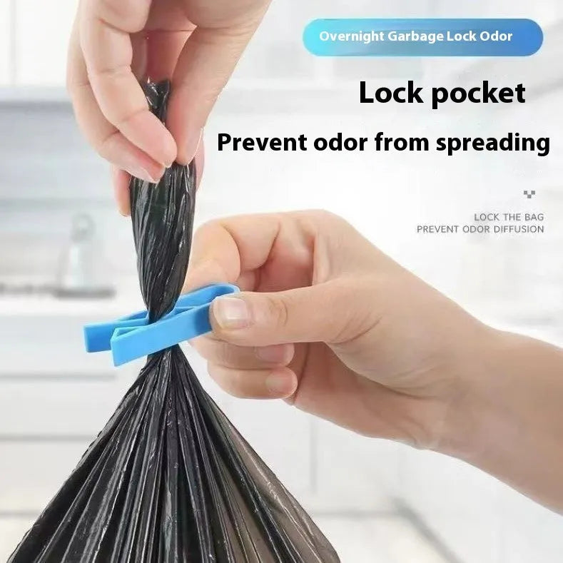 Grey PP plastic non-slip clip for fixing a bin bag to a waste bin rim.