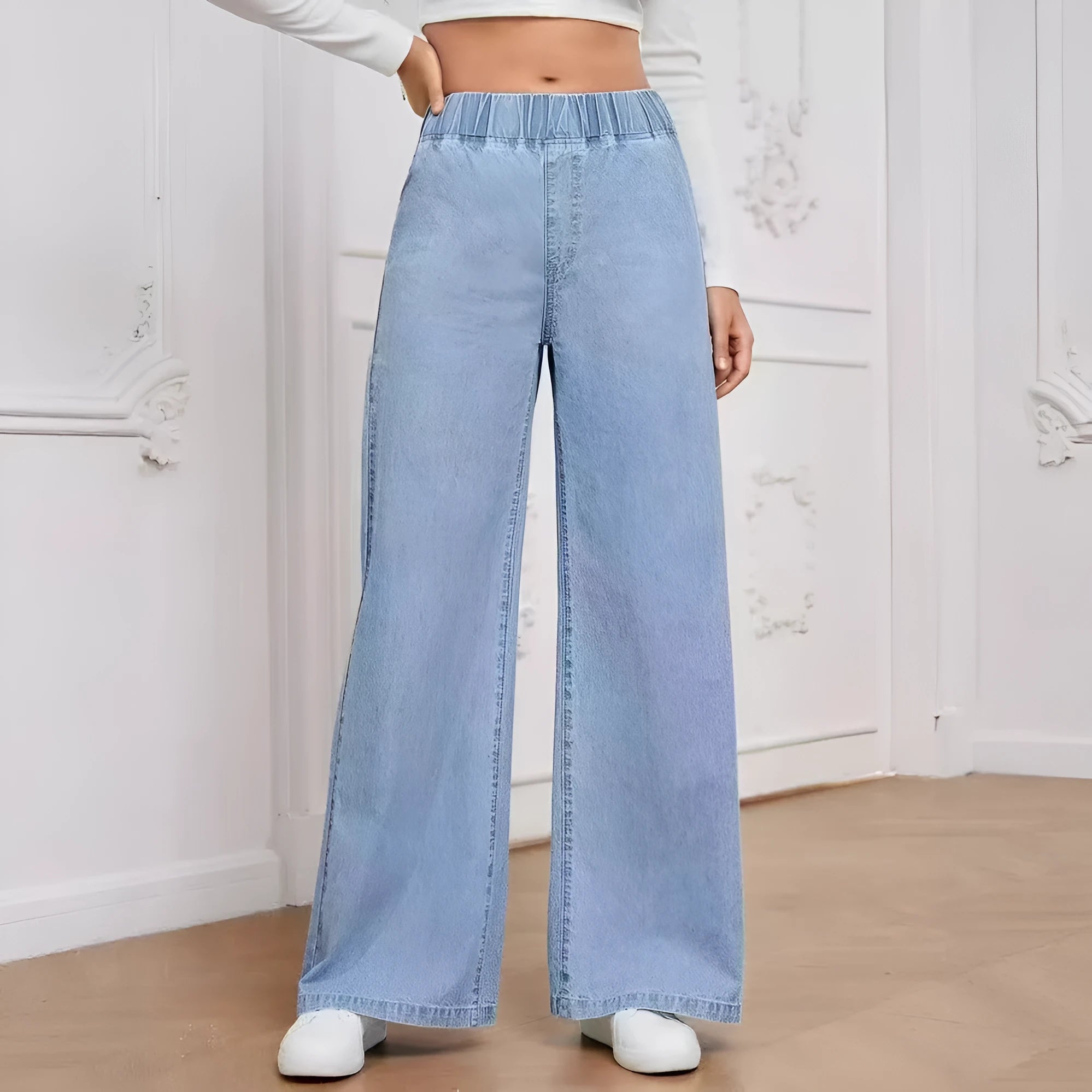 Light blue washed wide-leg denim trousers with straight cut and zip placket fly