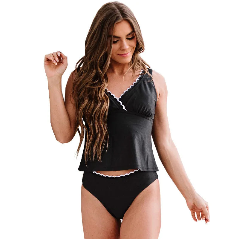 Black solid colour sleeveless one-piece swimsuit for women on a hanger.