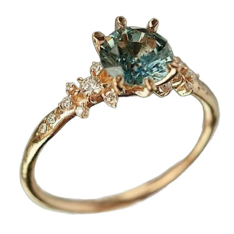 Gold plated geometric ring with claw inlaid zircon stones in chamfered square pattern
