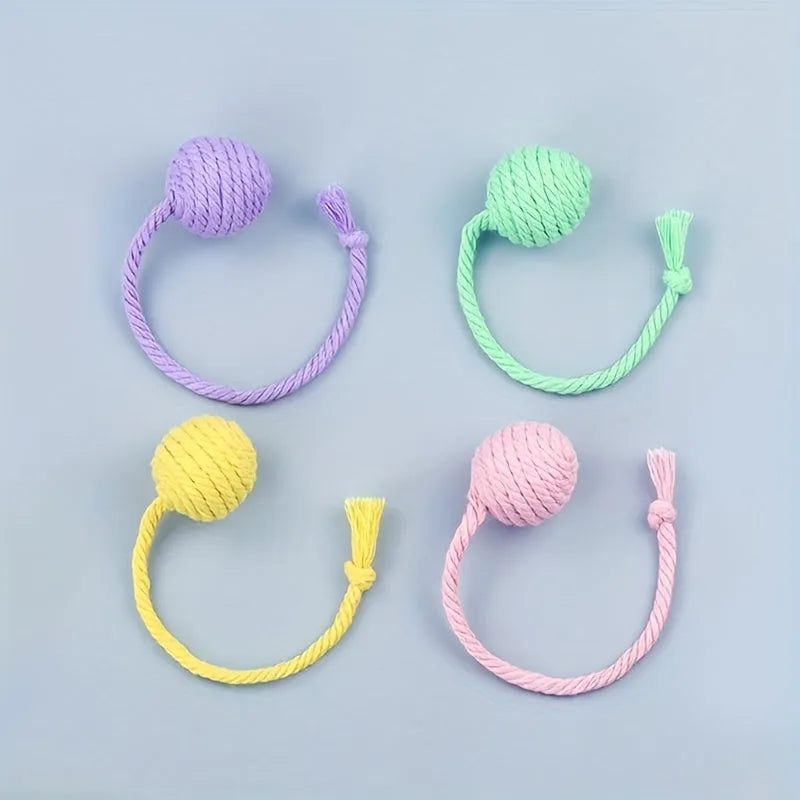 Green cat toy ball with a built-in rope and bell in a 6cm size.