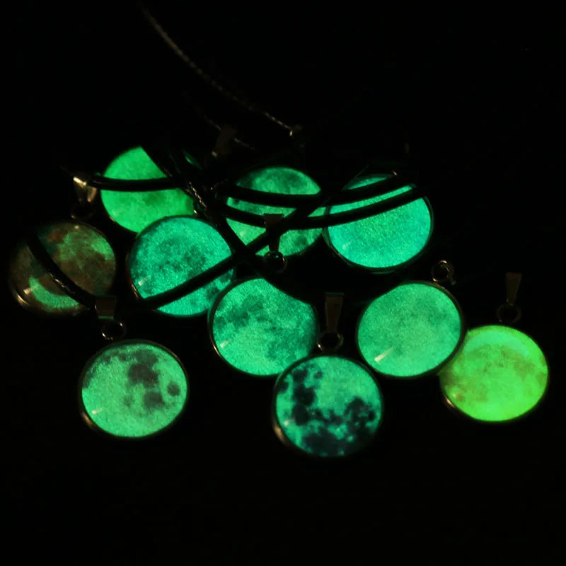 Christmas moon and night sky luminous constellation pendant on a glass necklace chain.