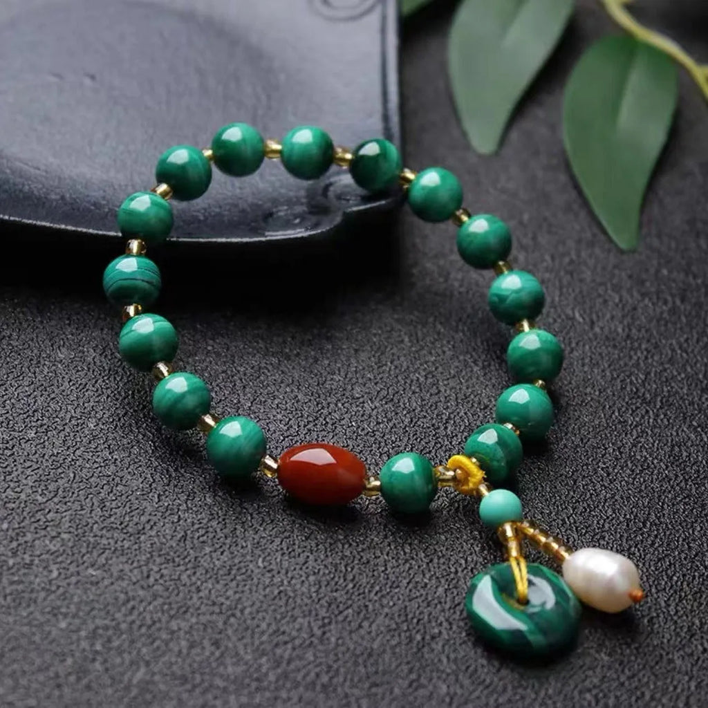 Natural green malachite bracelet with red agate barrel beads measuring 7-8mm