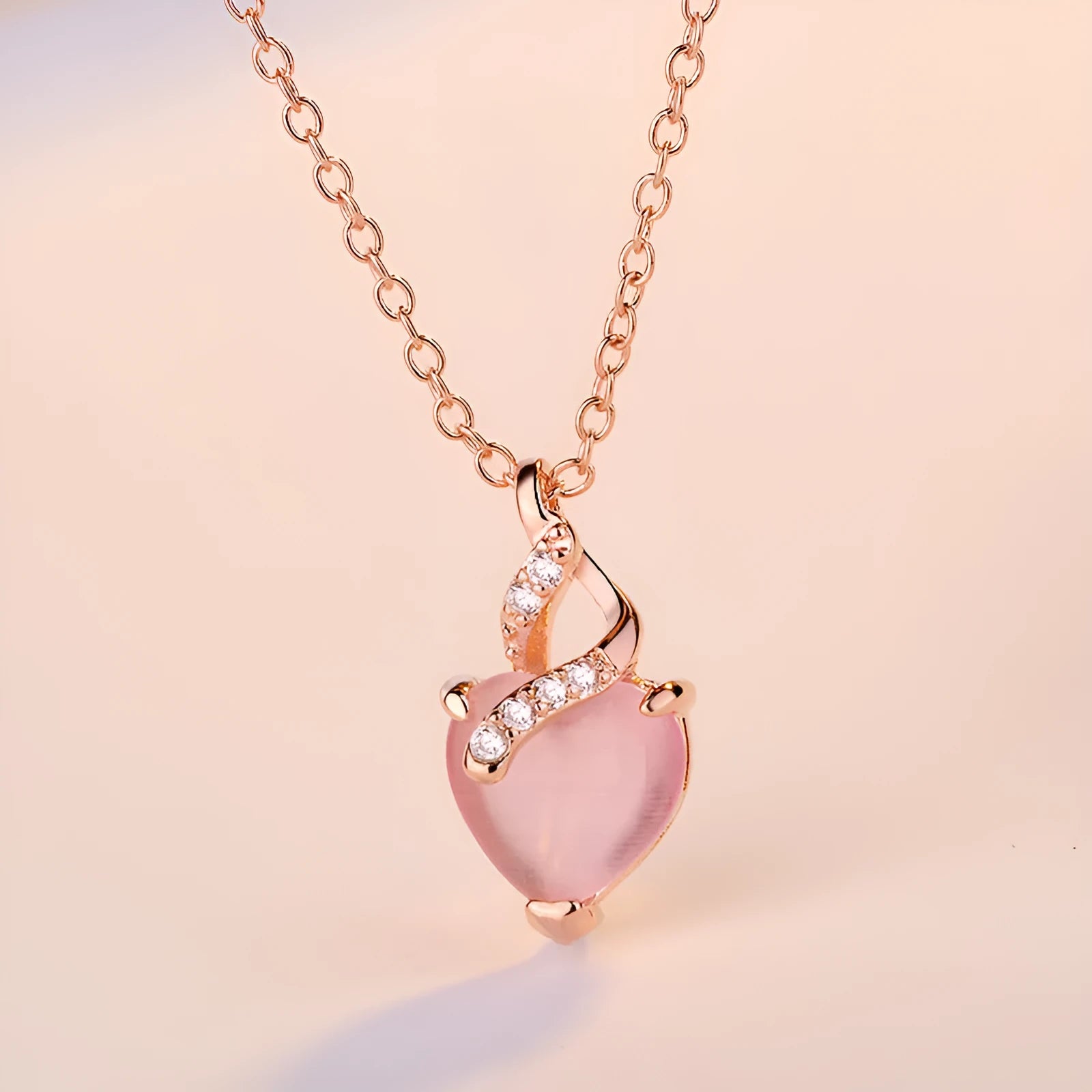 Women's heart-shaped pink crystal pendant necklace with rose gold electroplated cross chain