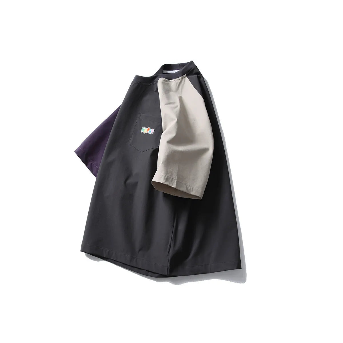 Dark grey loose fit quick-dry t-shirt with contrast raglan sleeves on a hanger.