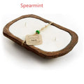 Lavender-scented soy wax candle in retro wooden basin with wooden wick