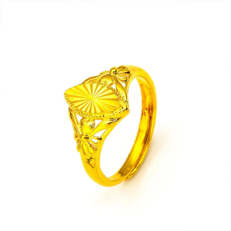 Geometric brass flower ring with gold electroplated finish showing textured diamond design