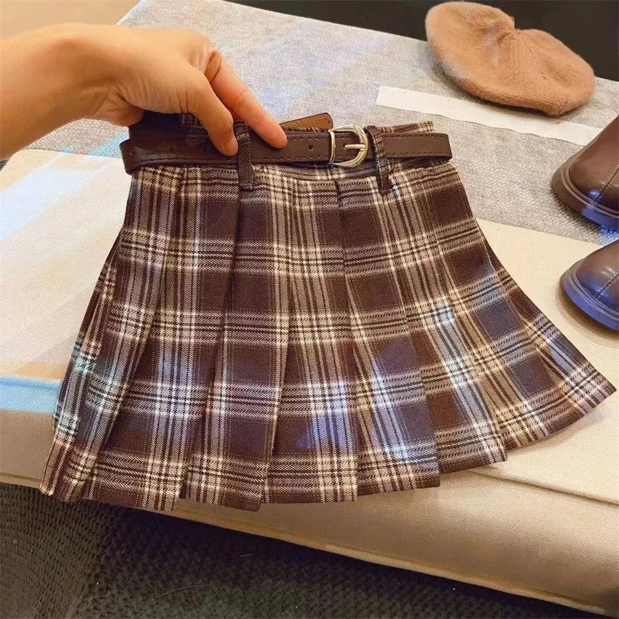 Girls' plaid pattern pleated A-line skirt in cotton blend fabric.