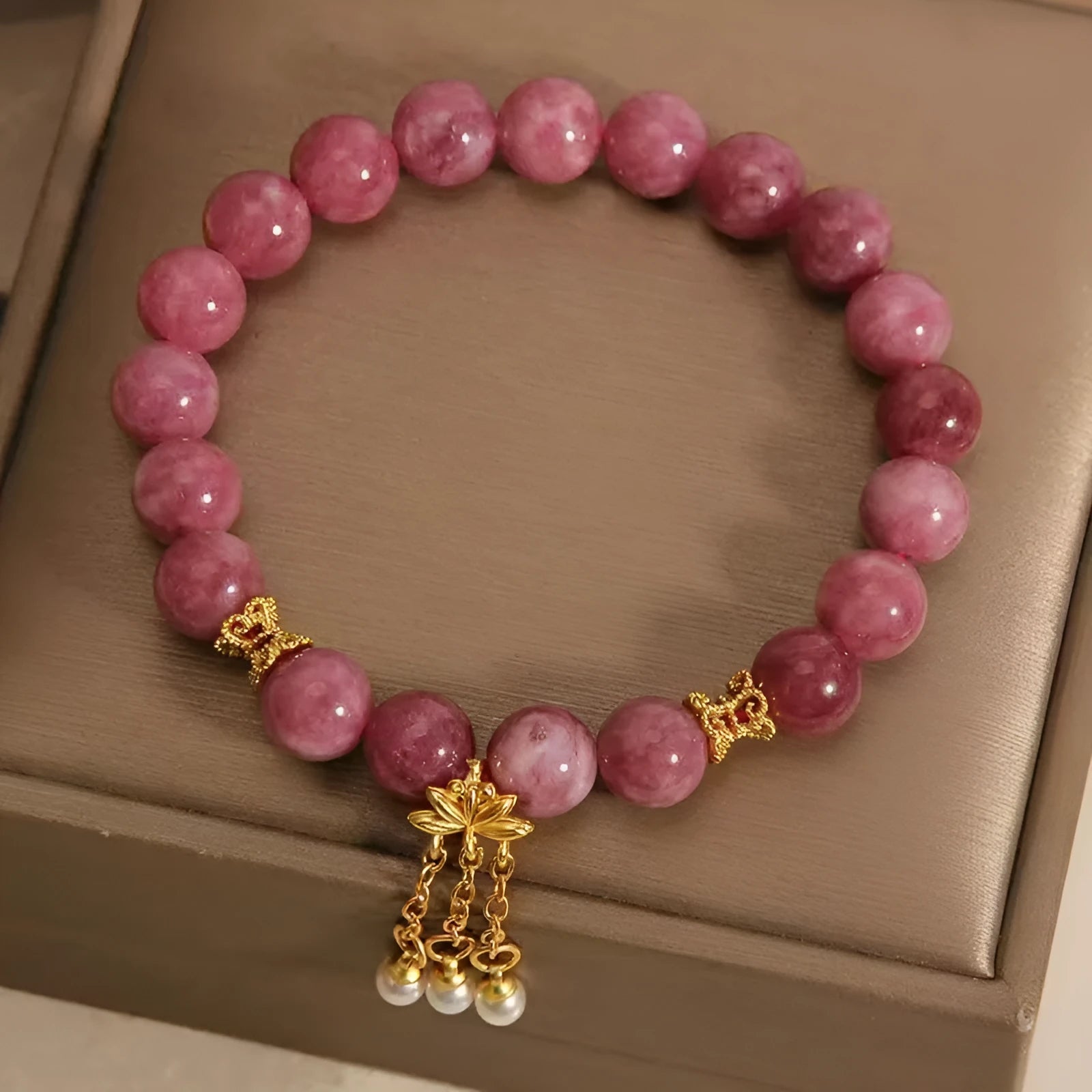 Pink lotus tassel bracelet with natural stone beads and crystal accents