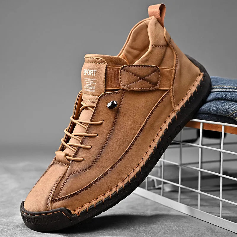 Men's mid-calf black Martin boots with tooling stitching and an elastic band side closure.