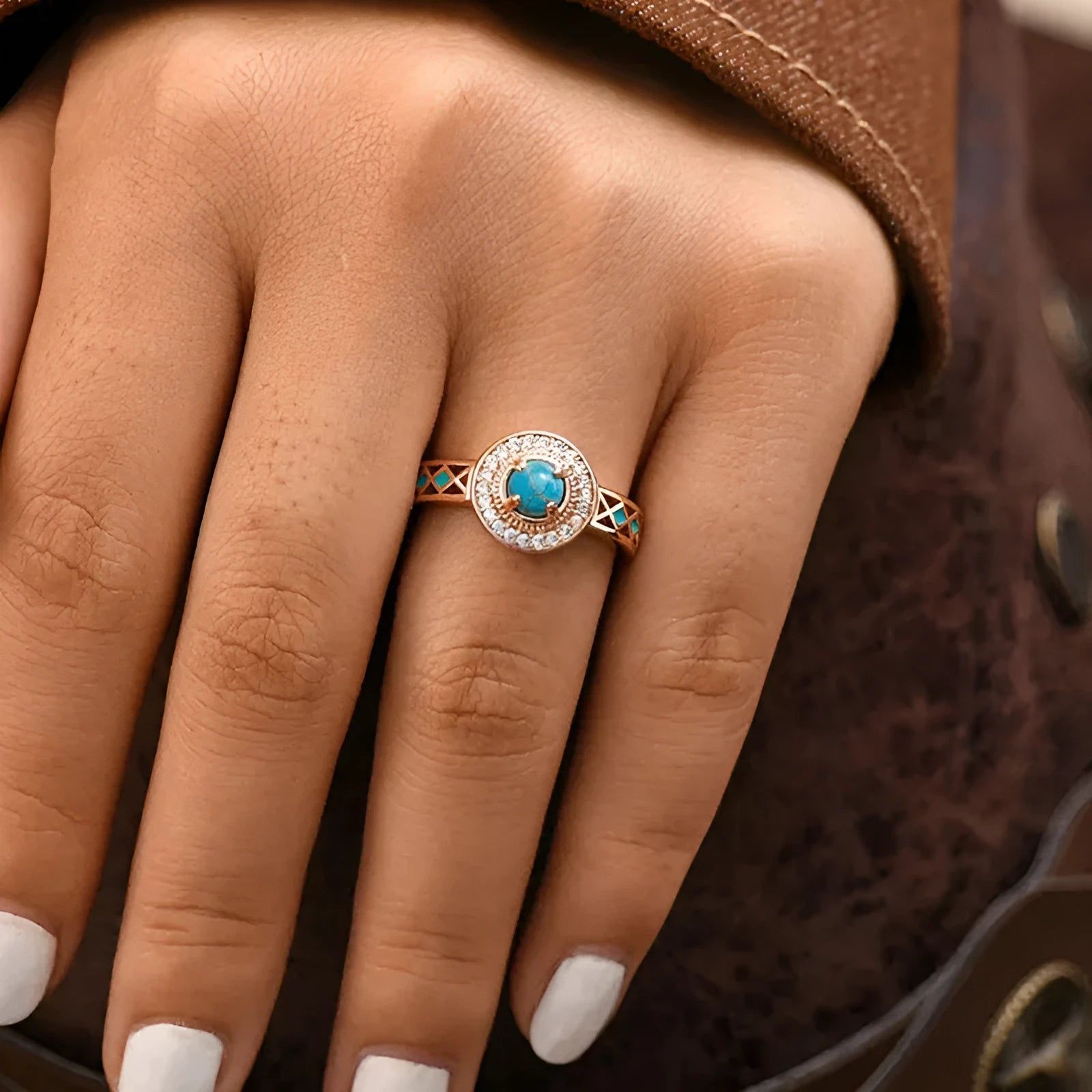 Women's turquoise geometric square ring with inlaid zircon stones on a rose gold band.