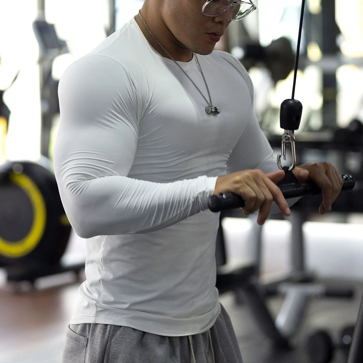 Men's white slim-fit long sleeve fitness top for running and sports activities