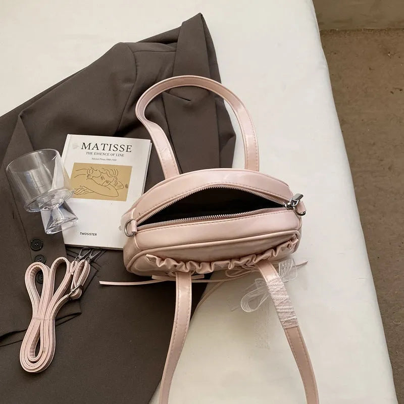 Women's bandage bow PU leather handbag with shoulder strap and internal phone compartment