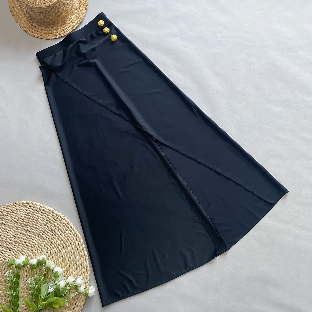 Women's brown one-piece swimsuit with matching beige skirt on a hanger