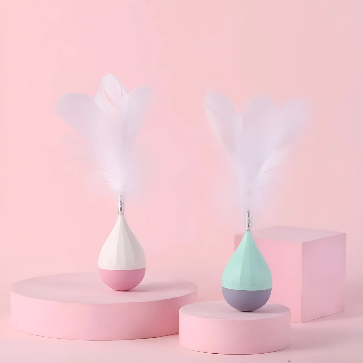 Feather tumbler cat toy with aluminium alloy construction and goose feather attachment in pink or green