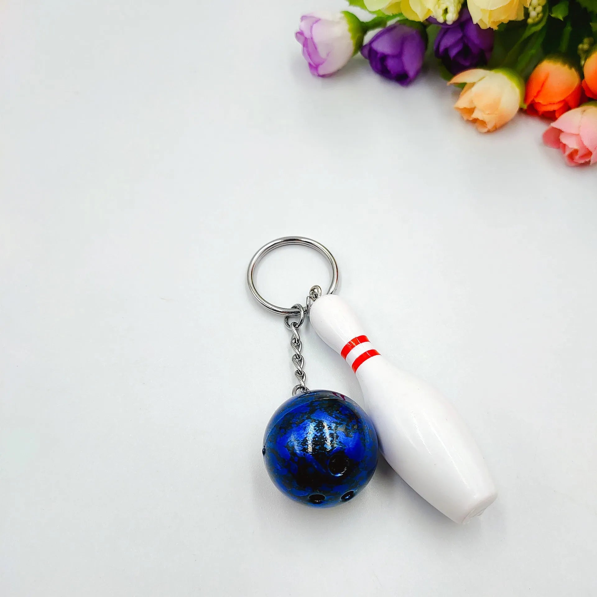 Mini bowling pin simulation keychain pendant in blue colour with metal keyring attachment