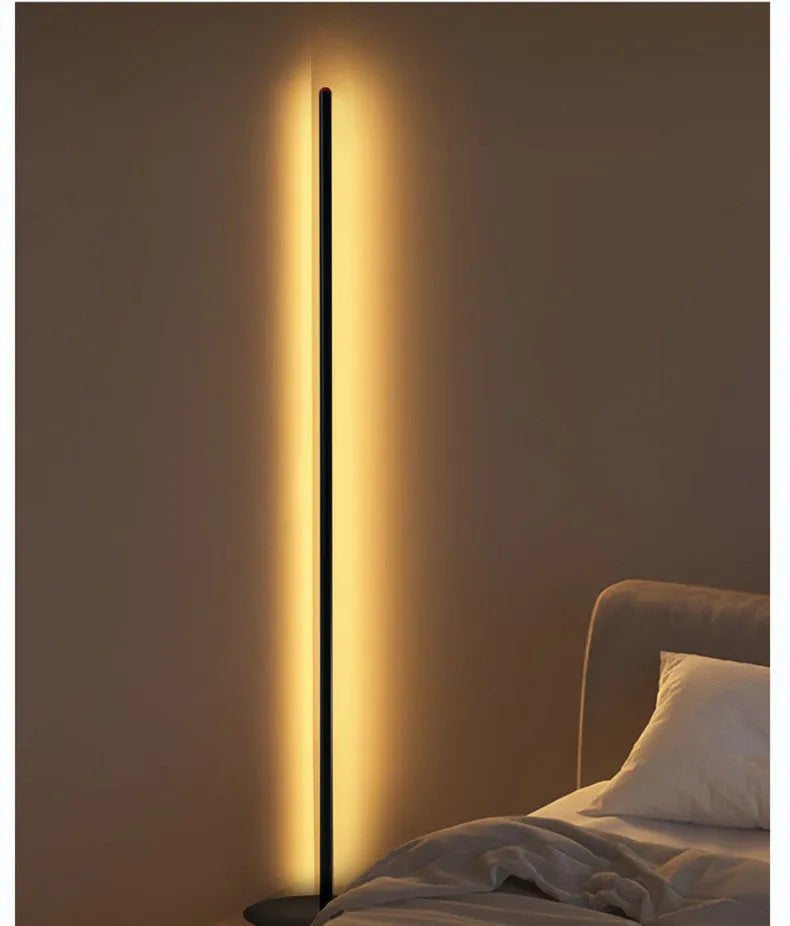 Tall, slim aluminium alloy vertical floor lamp with a LED light source on a modern stand.