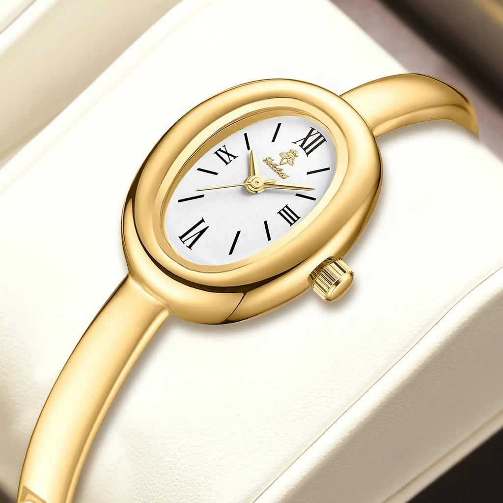 Women's oval retro quartz watch with 8mm thickness showing gold and spiral pattern colour options